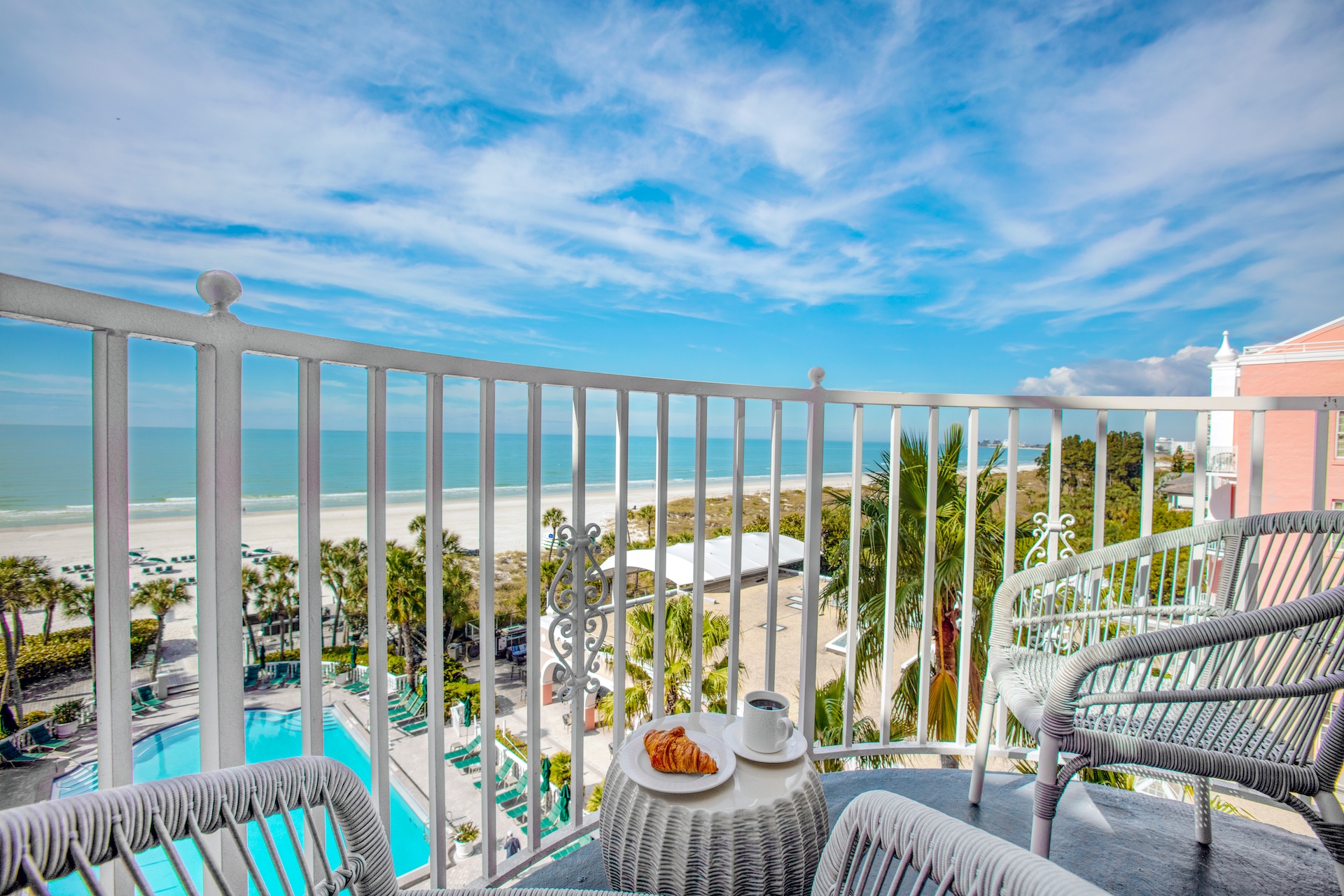 Balcony view from a Don CeSar guest room looking out over the property and Gulf.